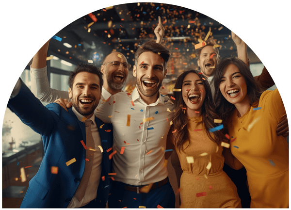A group of adults cheering as confetti rains down