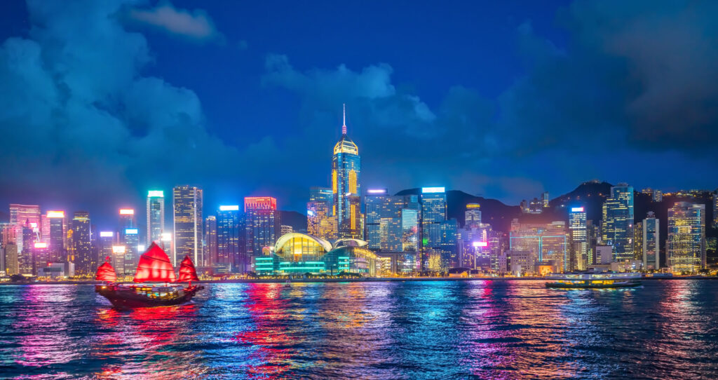 Panoramic view of Victoria Harbor and Hong Kong skyline in China at sunset